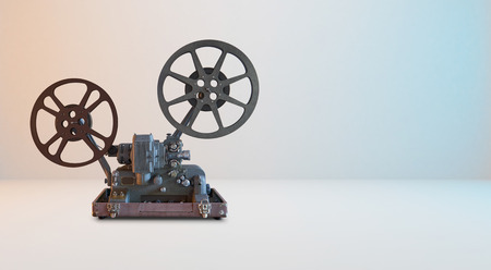 Old vintage cinema movie projector with white horizontal background .の写真素材