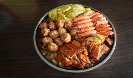 Chinese new year traditional food , big bowl feast together with chicken, duck, fish, yuba, radish, shiitake, pork,prawn,abalone . Meaning reunion and rich .の写真素材