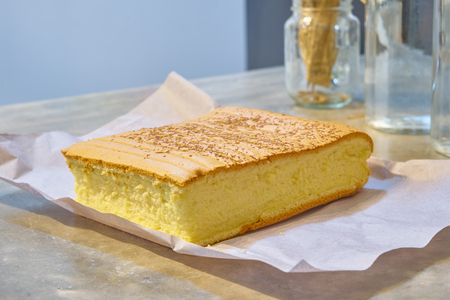 Delicious bake cheesecake on cement table .の写真素材