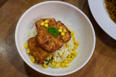 Fried pork chop with rice and corn . Asian delicacies foods .の写真素材