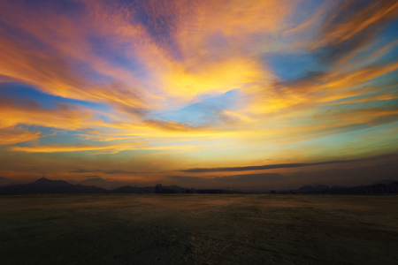 Empty concrete cement floor with dramatic evening orange and yellow sky .の写真素材