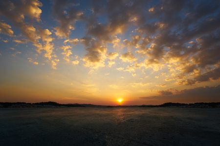 Empty concrete cement floor with beautiful and dramatic golden hour  sunset sky .の写真素材