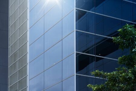 Abstract steel and glass facade detail background of high rise commercial building .Business or industrial successful concept background .の写真素材