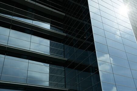Abstract steel and glass facade detail background of high rise commercial building .Business or industrial successful concept background .の写真素材