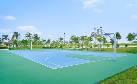 Outdoor open basketball court under sunny sky . Healthy lifestyle sport background .の写真素材
