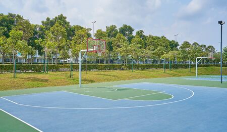 Outdoor open basketball court under sunny sky . Healthy lifestyle sport background .の写真素材