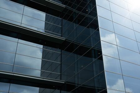 Abstract steel and glass facade detail background of high rise commercial building .Business or industrial successful concept background .の写真素材