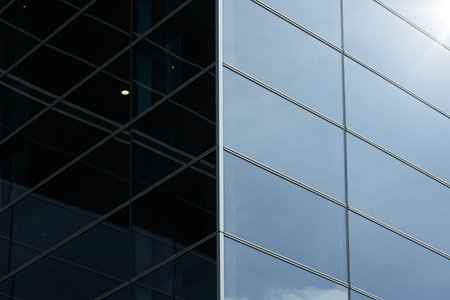 Abstract steel and glass facade detail background of high rise commercial building .Business or...
