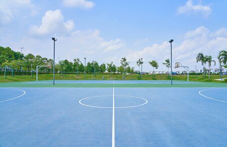 Outdoor open basketball court under sunny sky . Healthy lifestyle sport background .の写真素材