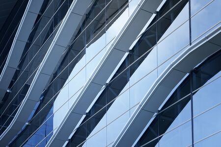 Abstract steel and glass facade detail background of high rise commercial building .Business or industrial successful concept background .の写真素材