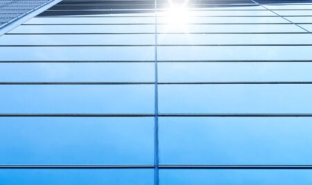 Abstract steel and glass facade detail background of high rise commercial building .Business or industrial successful concept background .の写真素材