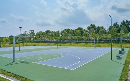 Outdoor open basketball court under sunny sky . Healthy lifestyle sport background .の写真素材