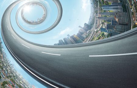 Abstract rotating highway with distorting city skyline .The concept of abstract urban background .の写真素材