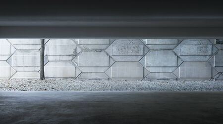 Basement indoor empty car park with cement facade .