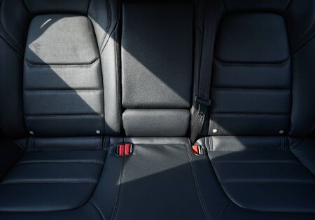Closeup of a modern car interior with the black leather rear seatsの写真素材