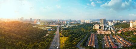 Panorama wide angle view cityscape,green park,terrace house and highway located at Kuala Lumpur,Malaysia .の写真素材