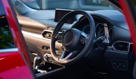 Vehicle interior of a modern car with steering wheelの写真素材
