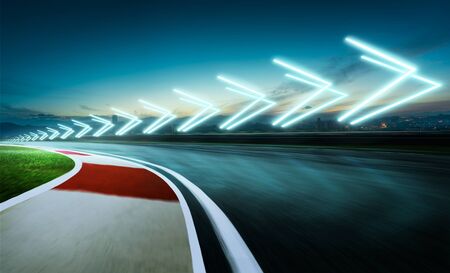 Neon light forward arrow signs on the racetrackの写真素材