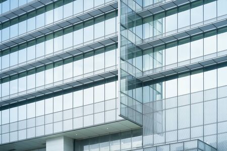 Modern and glass windows office building for backgroundの写真素材