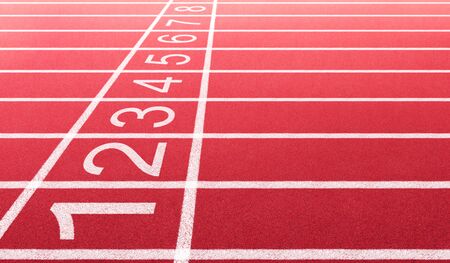Athlete running track with number on the start . Side view and close-up angle .の写真素材