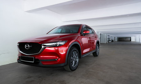 Kuala Lumpur, Malaysia - July 26, 2019: Mazda CX 5 three quarter view. Modern crossover SUV parking...