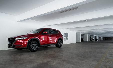 Kuala Lumpur, Malaysia - July 26, 2019: Mazda CX 5 three quarter view. Modern crossover SUV parking...