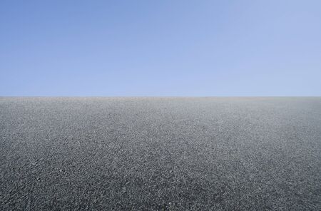 Empty asphalt floor with clean blue sky background .の写真素材