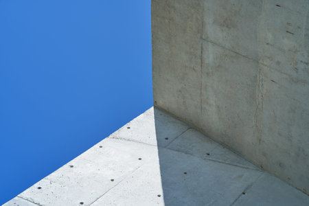 Abstract geometric view of modern building with blue sky .