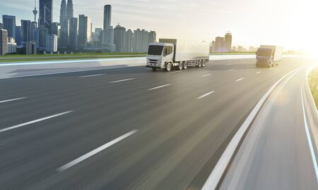 Two delivery truck run on the road with sunrise cityscape, fast delivery,cargo logistic and freight shipping concept. 3d rendering.の写真素材