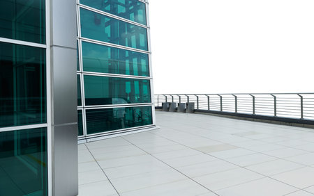 Exterior of a modern glass wall facade building with clean marble floor . isolated on white background .の写真素材