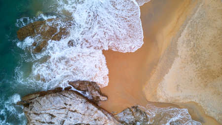 Aerial view of beach with rocky and waves, beautiful tropical beach located at Terengganu, Malaysiaの写真素材