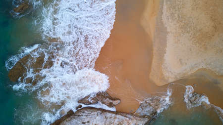 Aerial view of beach with rocky and waves, beautiful tropical beach located at Terengganu, Malaysiaの写真素材