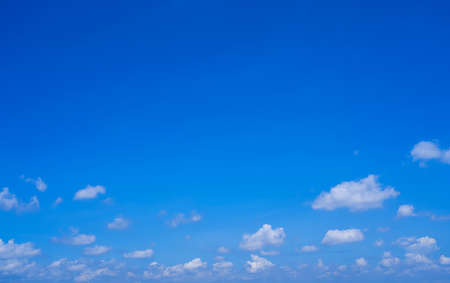 Beautiful and clean blue sky with fluffy white clouds, summer sky background.の写真素材