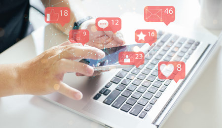 Businessman using smartphone with social media icon.Social media marketing concept.