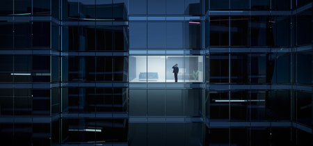 Businessman using mobile phone to talk business in office. View from the outside 3D rendering commercial skyscraper.の写真素材