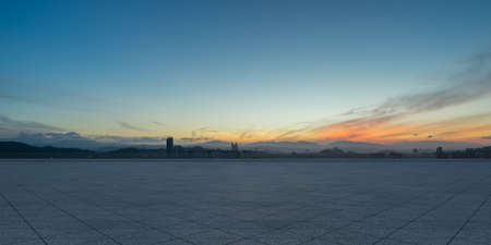 Empty triangle shape stone tiles floor with sky.の写真素材