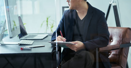 Close up businessman write marketing tips note at office