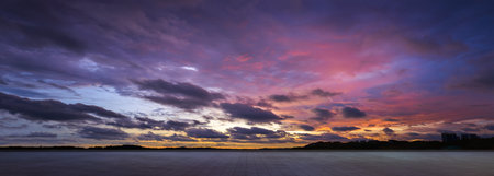 Empty tiles floor with dramatic suset skyの写真素材
