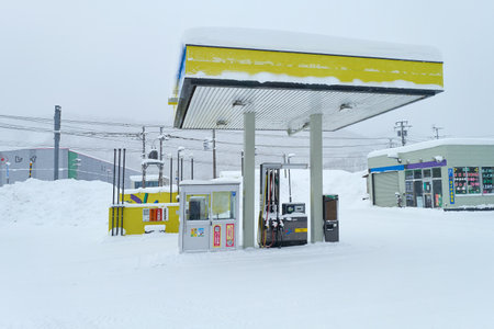 Hokkaido, Japan - December 19, 2022 : The gas station with snow during winter season in Hokkaido, Japanのeditorial素材