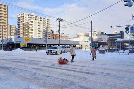 Hokkaido, Japan - December 20, 2022 : Snow-covered streets of Sapporo. Sapporo downtown is popular tourist attractions in Hokkaido,Japanのeditorial素材