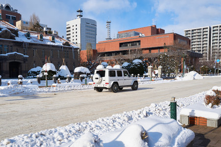 Hokkaido, Japan - December 20, 2022 : A white luxury Mercedes Benz G-Class driving in downtown Sapporo Hokkaidoのeditorial素材