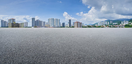 Empty asphalt floor with cityscape backgroundの写真素材