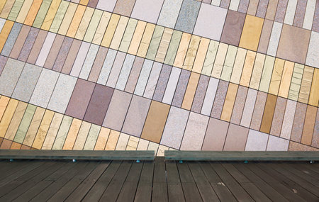 Wooden flooe with golden rectangle marble stone tiles background