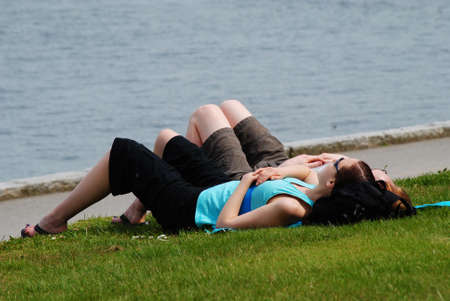 Couple Lying on the Grassの写真素材