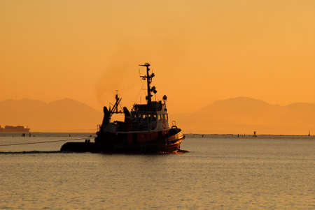 towboat at sunsetの写真素材