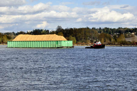 tugboat pulling a container shipのeditorial素材