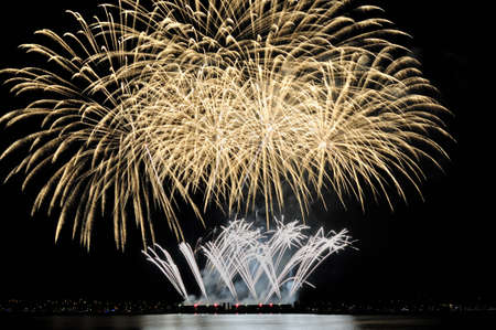 two layers of fireworks forming a beautiful artworkの写真素材