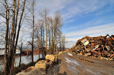 junkyard by a riverの写真素材