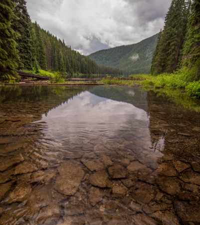 Polarizing filter was used to cut the reflection on the lake to see the rocks on the lake bottom の写真素材