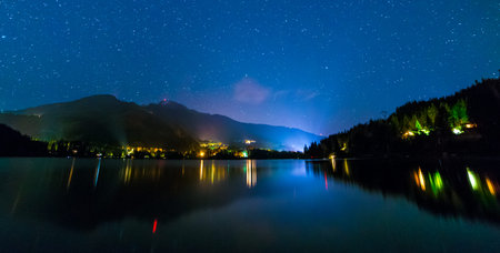 Night shot of Alta Lake with stars and Whistler Lights 